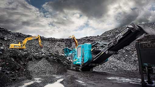 Trakpactor 550 Impact crusher with dramatic sky 