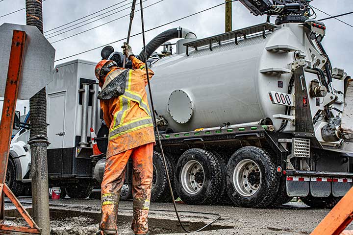 Hydro-vac excavation worker and equipment