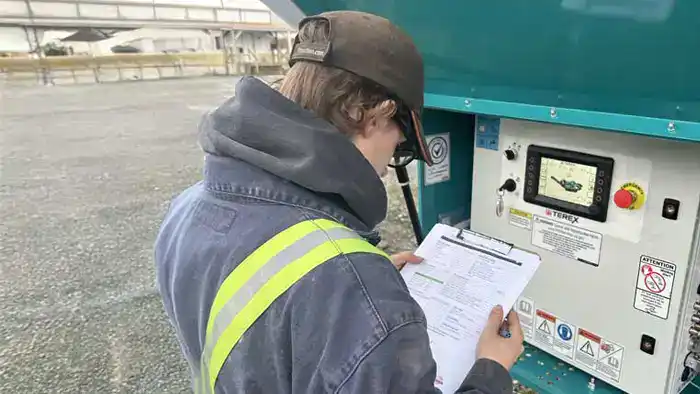 Foreman serviceman prepares rental inspection report. 